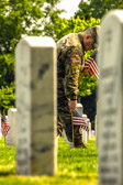 General Mark A. Milley who serves as the 20th Chairman of the Joint Chiefs of Staff placed flags at the headstone of the fallen in Section 60 of Arlington National Cemetery.
